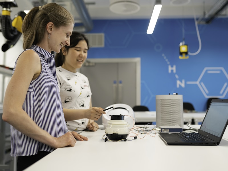 Professional electrical consultation with solar system blueprints and technical specifications